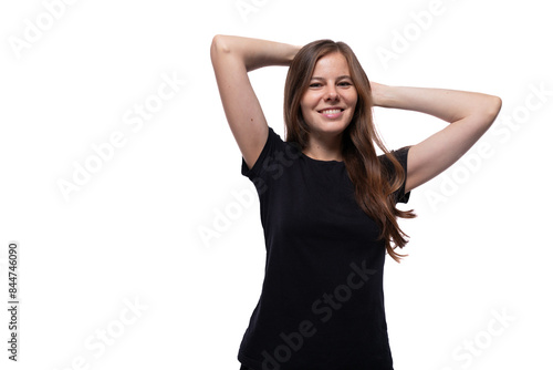 Portrait of a young woman dressed in basic clothing with a mockup for print