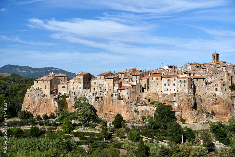 view of historic buildings built on tuff rock in the town of Pitigliano view of historic buildings built on tuff rock in the town of Pitigliano