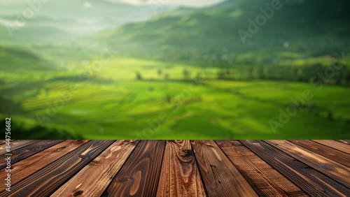 Empty wood table top with blur background of mountain and green nature. The table giving copy space for placing advertising product on the table along with beautiful forest nature scenery background. © Summit Art Creations