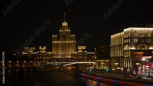 Night View on a Kotelnicheskaya Embankment Building, While Ship Sail Among Moscow RIver