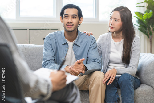 Psychology, Happy asian young woman and man couple love, consulting problem mental health together with psychologist at clinic, wife encouraging husband. Psychologist with patient sick mental therapy.