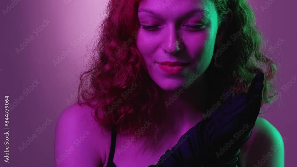 Evil woman. Cunning smile. Pretty glamour female scheming rub hands black gloves evening dress think revenge sneaky plan neon green violet gradient. Evil woman. Cunning smile. Pretty glamour female scheming rub hands black gloves evening dress think revenge sneaky plan neon green violet gradient.