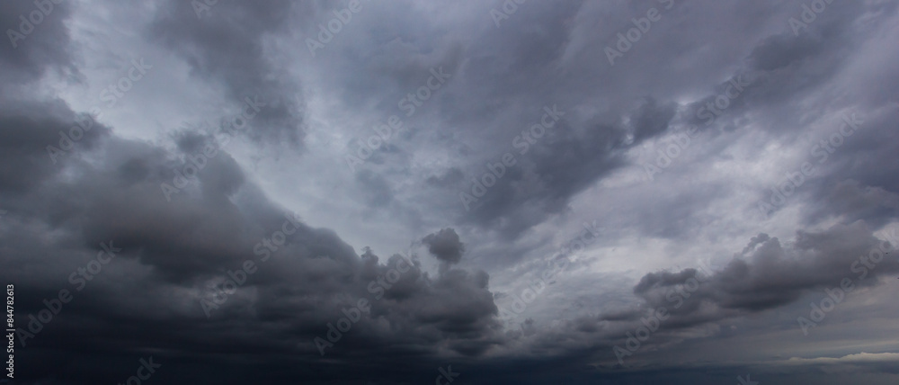 Bad or moody weather sky and environment. carbon dioxide emissions, greenhouse effect, global warming, climate change. The dark sky with heavy clouds converging and a violent storm before the rain. Bad or moody weather sky and environment. carbon dioxide emissions, greenhouse effect, global warming, climate change. The dark sky with heavy clouds converging and a violent storm before the rain.