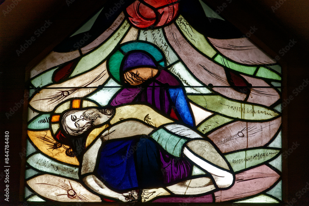A stained-glass window representing the Pieta. Un vitrail représentant la Piéta. Annecy - France A stained-glass window representing the Pieta. Un vitrail représentant la Piéta. Annecy - France