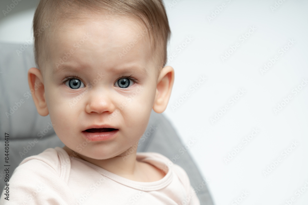 Baby makes a funny angry and sad face