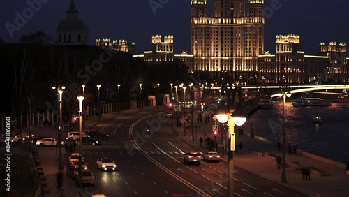 Beautiful Evening View on Kotelnicheskaya Embankment Building in Moscow, While Cars and People Passing By