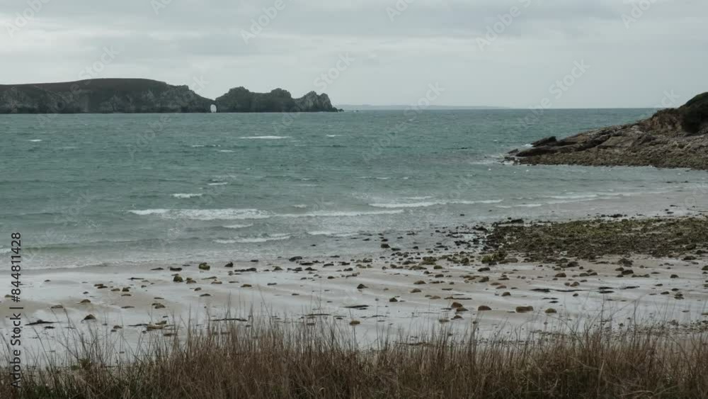 waves crushing ashore at the beautiful and rugged coastline of the atlantic ocean in Brittany, France. waves crushing ashore at the beautiful and rugged coastline of the atlantic ocean in Brittany, France.