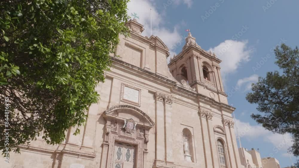 Walking through the trees to show St Lawrence's Church, Birgu Malta Walking through the trees to show St Lawrence's Church, Birgu Malta