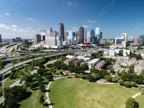 Dallas Skyline with green space urban park in foreground and a few Updown / State / Thomas Neighborhood