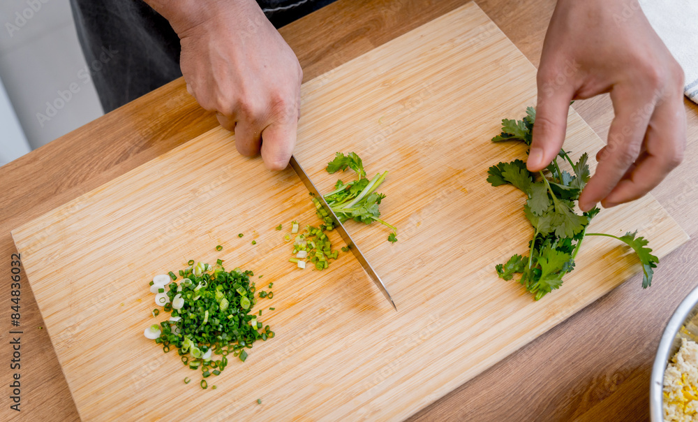 Chef at the kitchen preparing tofu scramble with vegetables Chef at the kitchen preparing tofu scramble with vegetables