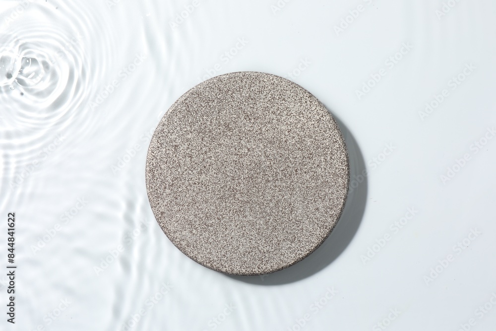 Presentation for product. Stone podium in water on white background, top view Presentation for product. Stone podium in water on white background, top view