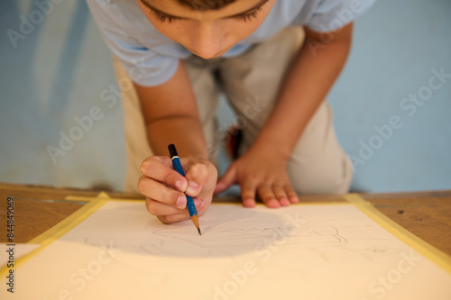 Photos Child drawing in art class, creativity and imagination fostered by hands-on lear
