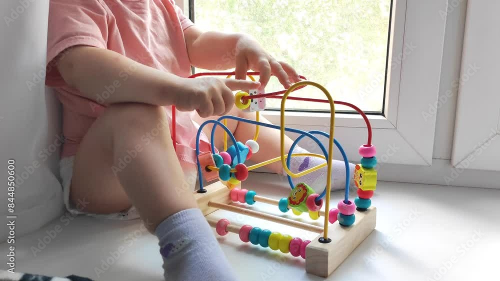 Baby toddler playing with an educational toy, educational activities and games for children Baby toddler playing with an educational toy, educational activities and games for children