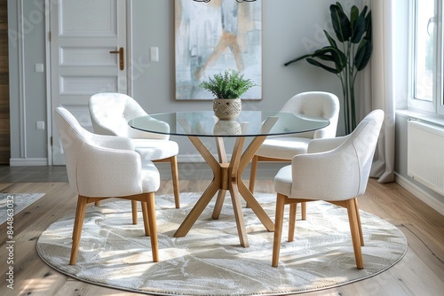 Modern dining area with glass table and upholstered chairs