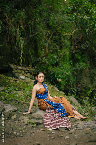 Asian woman wearing "Kemben" batik cloth