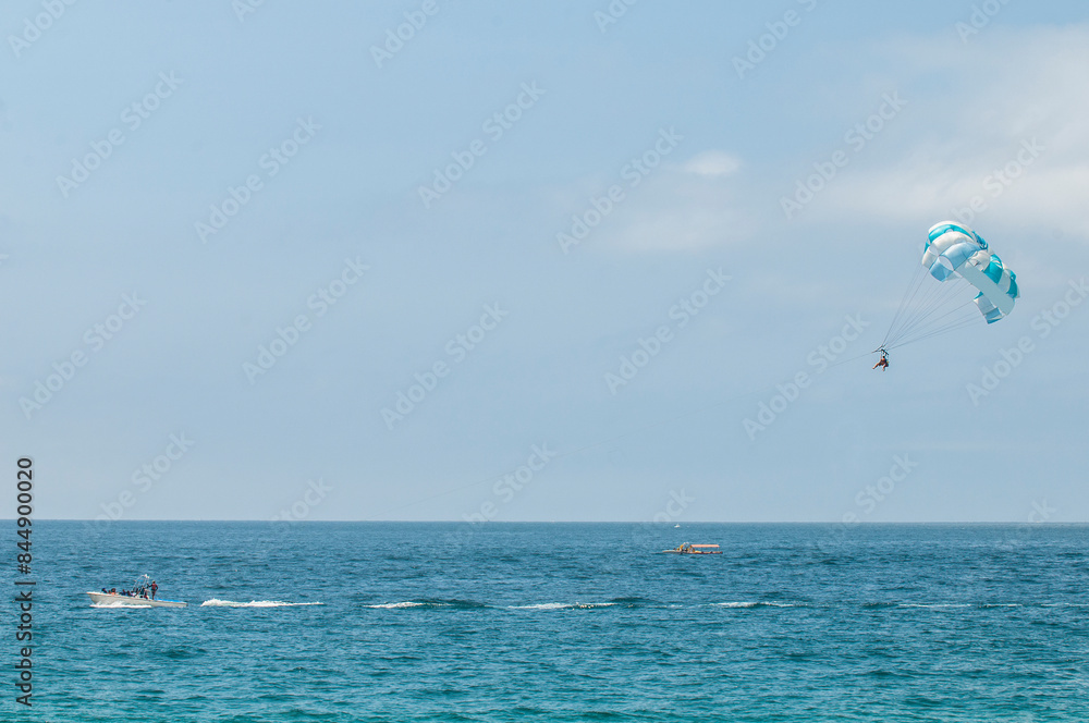 Vacations in the pacific ocean, parasailing boat in Los Cabos Near the arch or arc, Baja California peninsula in the state of Baja California Sur. MEXICO
Vacations in the pacific ocean, parasailing boat in Los Cabos Near the arch or arc, Baja California peninsula in the state of Baja California Sur. MEXICO