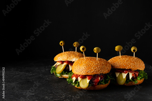 Three funny crazy monsters burgers photo