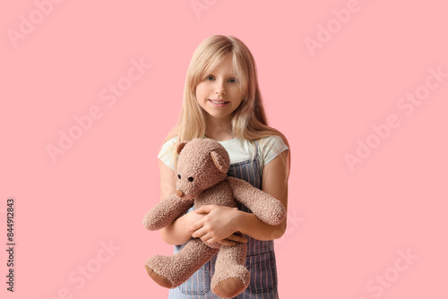 Cute little girl with plush...