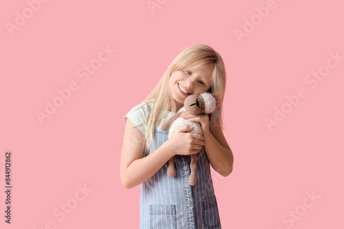 Cute little girl with plush...