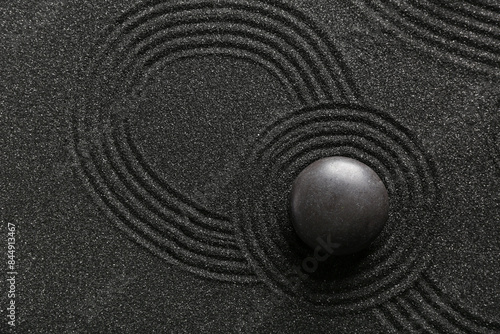 Canvas Print Spa stone on black sand with lines. Zen concept