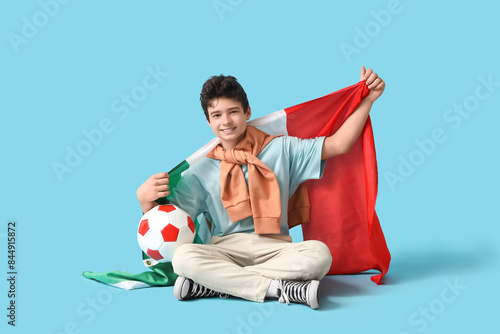 Teenage boy with soccer bal...