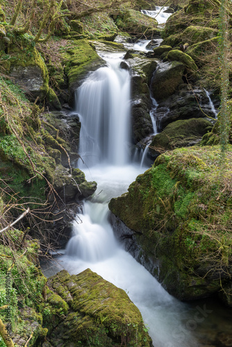 Long exposure of a waterfall on the Hoar Oak Water river at Watersmeet in Exmoor National Park photo