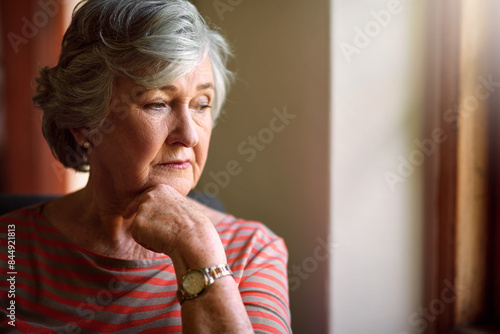 Photos Thinking, anxiety and senior woman in home living room to remember memory, stress or reflection of vision