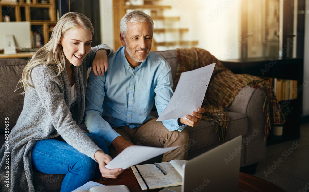 Happy couple, reading and insurance with paperwork for budget planning, bills or expenses on sofa at home. Man or woman with smile for documents, mortgage or financial freedom in living room at house Happy couple, reading and insurance with paperwork for budget planning, bills or expenses on sofa at home. Man or woman with smile for documents, mortgage or financial freedom in living room at house