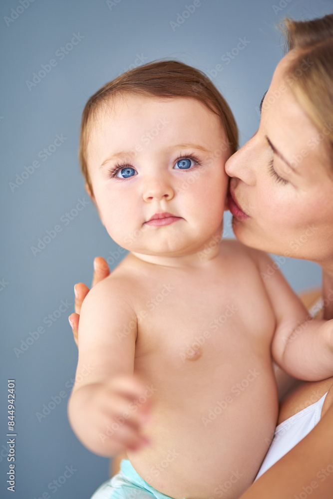 Mother, baby and portrait with kiss for care or childcare with support, love and cute as toddler and child development. Parent, kid and growth at home for bonding, childhood memories and safety Mother, baby and portrait with kiss for care or childcare with support, love and cute as toddler and child development. Parent, kid and growth at home for bonding, childhood memories and safety