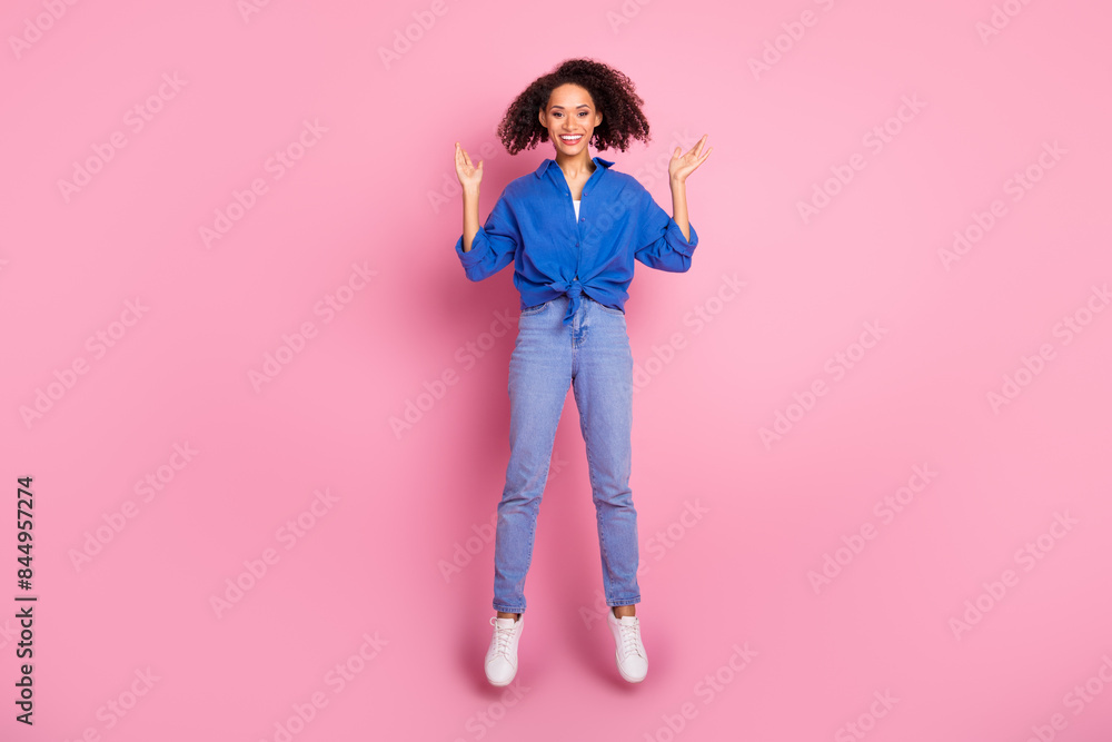 Photo of overjoyed adorable cheerful girl wear trendy blue clothes jump up have fun rejoice isolated on pink color background Photo of overjoyed adorable cheerful girl wear trendy blue clothes jump up have fun rejoice isolated on pink color background