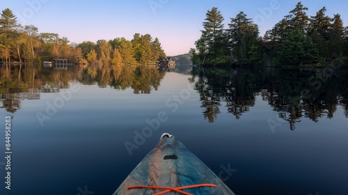 Springtime kayaking along the shores of Joseph Lake in the Muskokas of Ontario, Canada