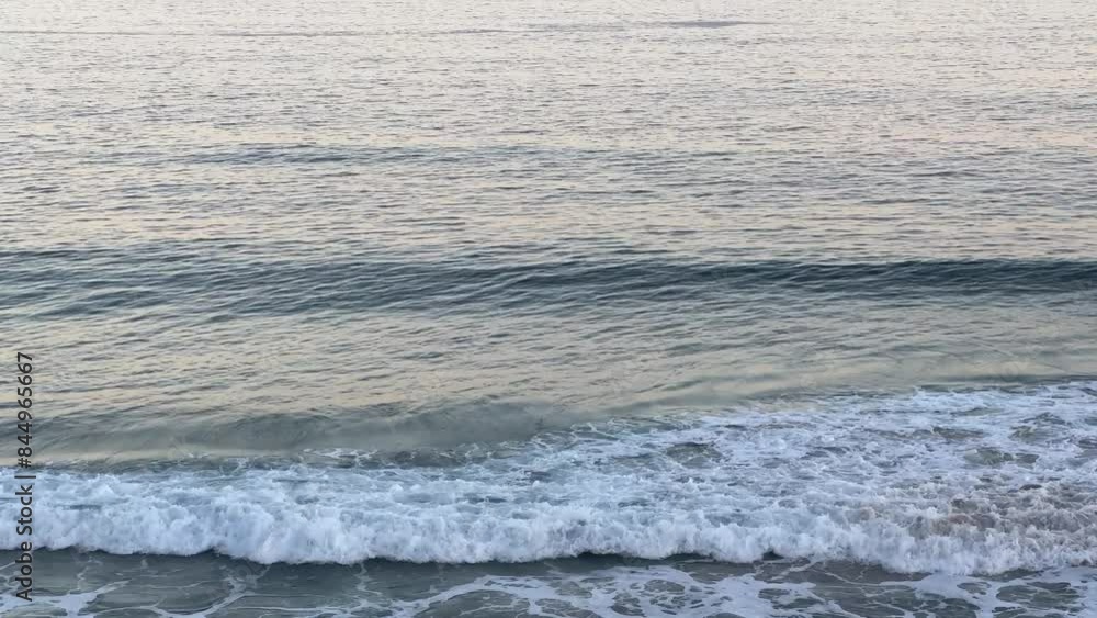 Peaceful endless ocean waves rolling in at sunset in 4k landscape footage Peaceful endless ocean waves rolling in at sunset in 4k landscape footage