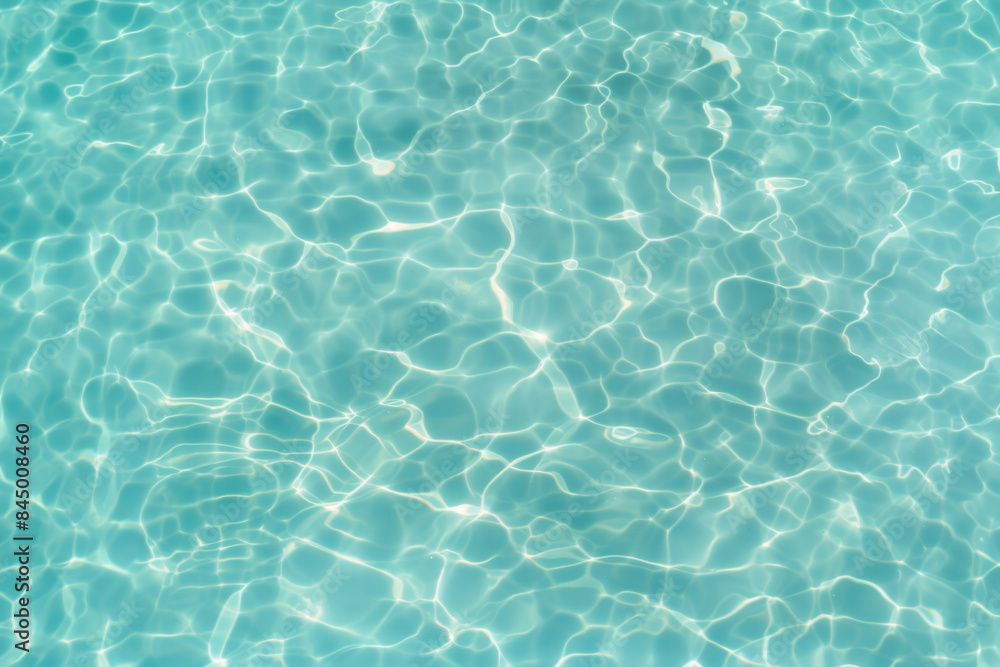 Up view photo of still transparent turquoise surface of the water of the swimming pool	