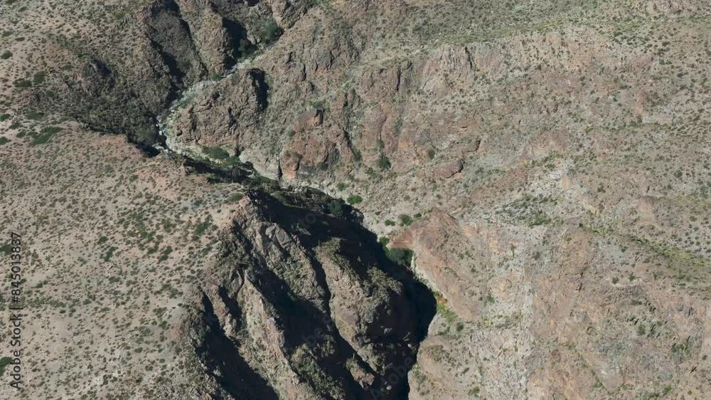Aerial Shot of Rugged Rocky Canyon and Arid Desert Terrain in Amaicha del Valle, Tucumán (Cascada El Remate) Aerial Shot of Rugged Rocky Canyon and Arid Desert Terrain in Amaicha del Valle, Tucumán (Cascada El Remate)