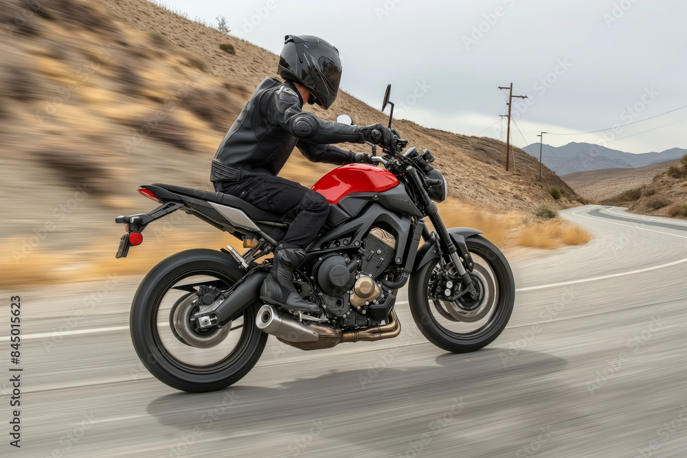 Motorcyclist riding on a country road Motorcyclist riding on a country road