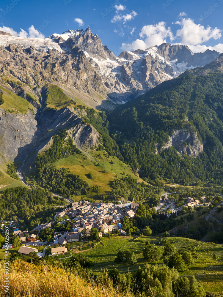 Fototapeta premium La Grave village in Ecrins National Park with view of La Meije peak and glacier in summer. Part of the famous GR 54 mountain treck. Hautes-Alpes, Alps, France