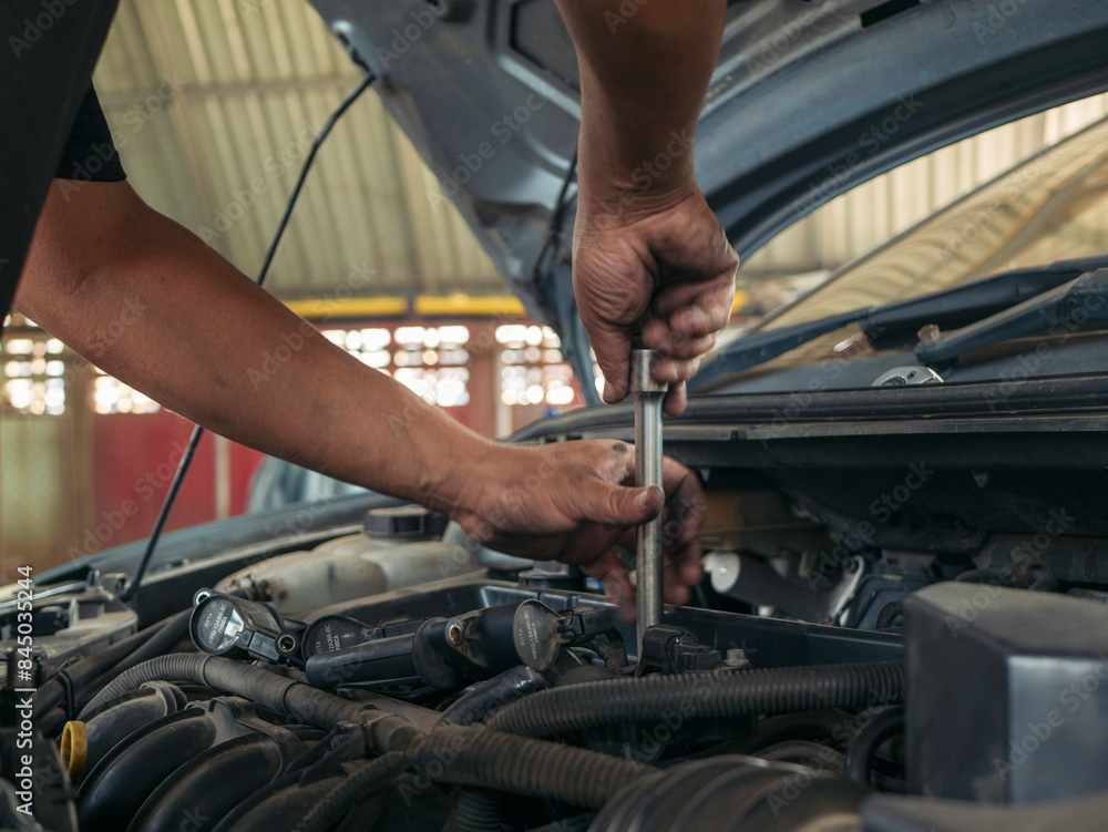 Close up Man hands fixing Car machinery vehicle mechanical service. Mechanic man hands repairing car auto repair shop. open vehicle hood checking up auto mobile. Vehicle Car maintenance engineer. Close up Man hands fixing Car machinery vehicle mechanical service. Mechanic man hands repairing car auto repair shop. open vehicle hood checking up auto mobile. Vehicle Car maintenance engineer.