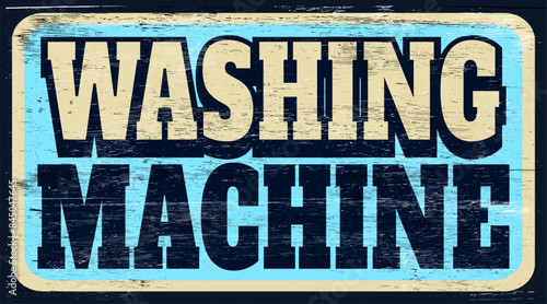 Aged retro washing machine sign on wood