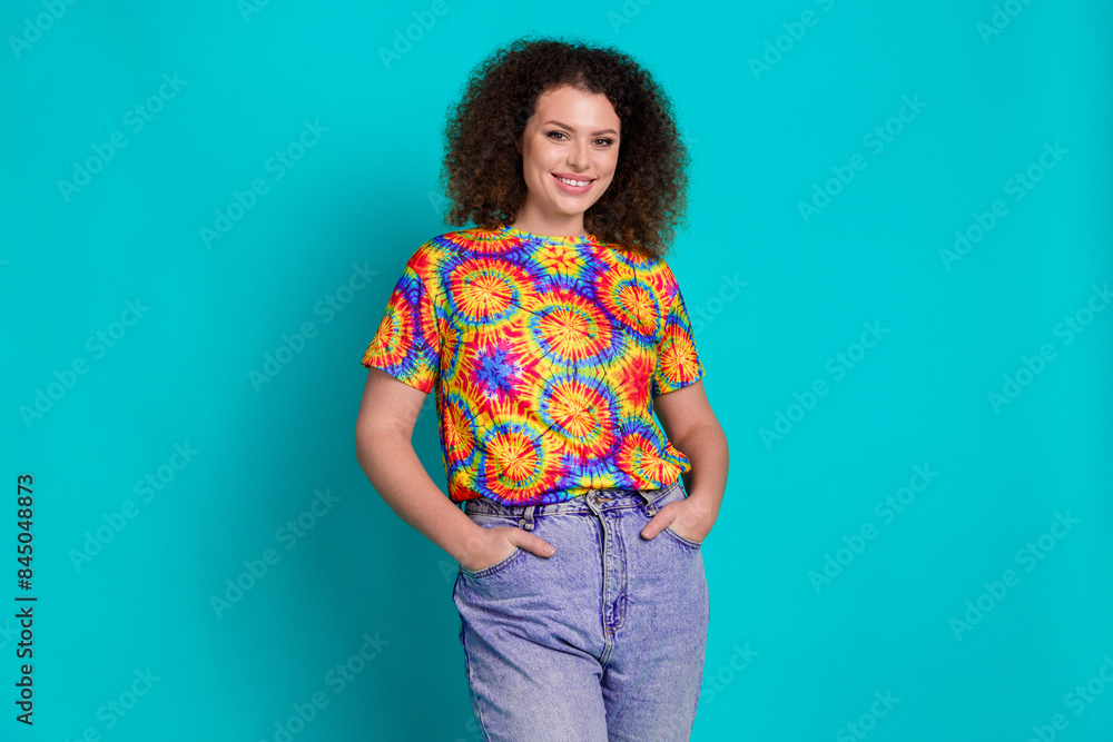 Photo of adorable positive woman wear stylish print clothes outfit isolated on cyan color background Photo of adorable positive woman wear stylish print clothes outfit isolated on cyan color background