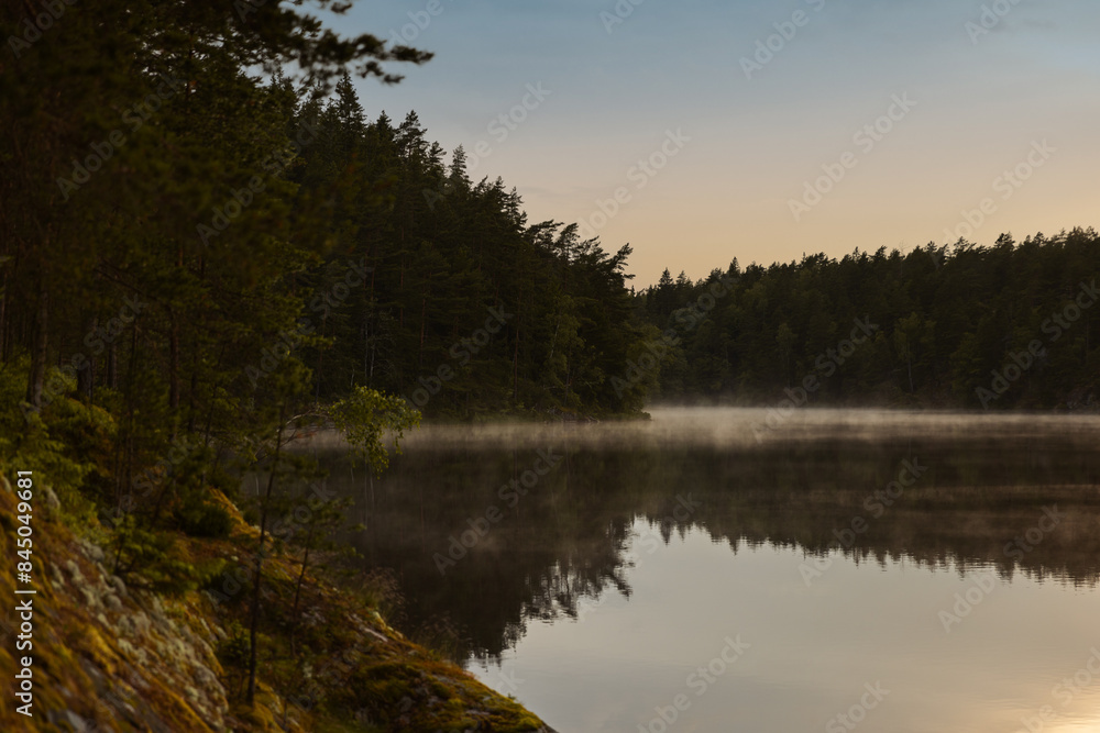 Frost smoke on a forest lake at sunset Frost smoke on a forest lake at sunset