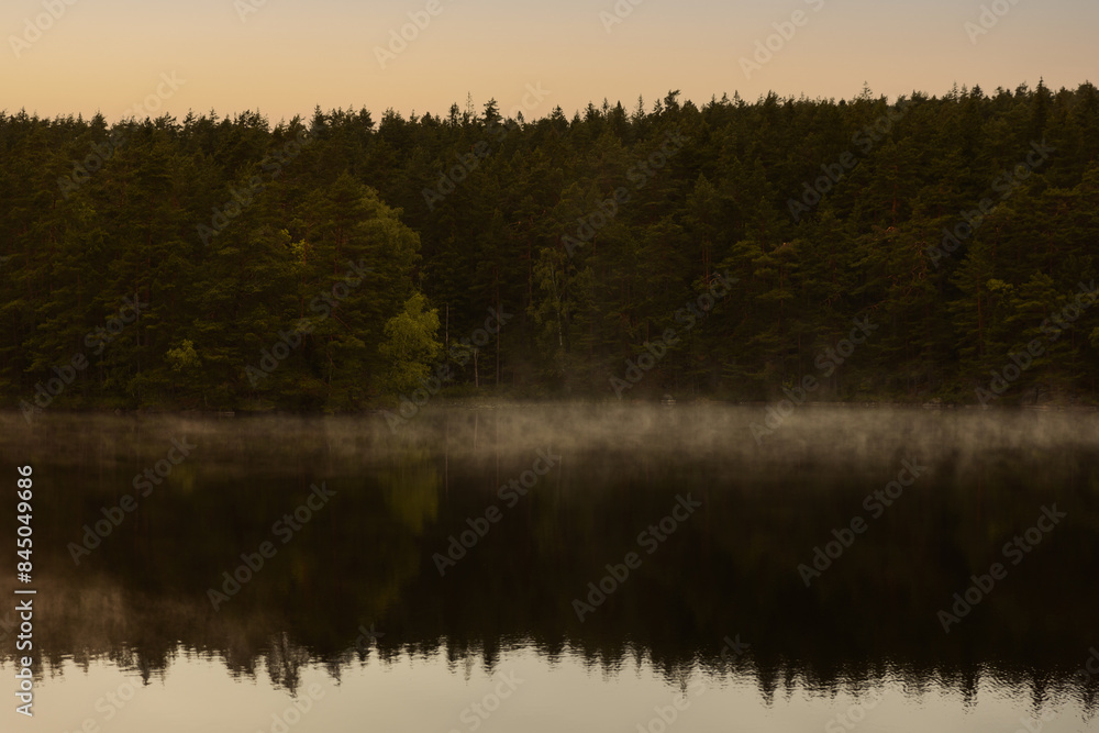Frost smoke on a forest lake at sunset. Frost smoke on a forest lake at sunset.