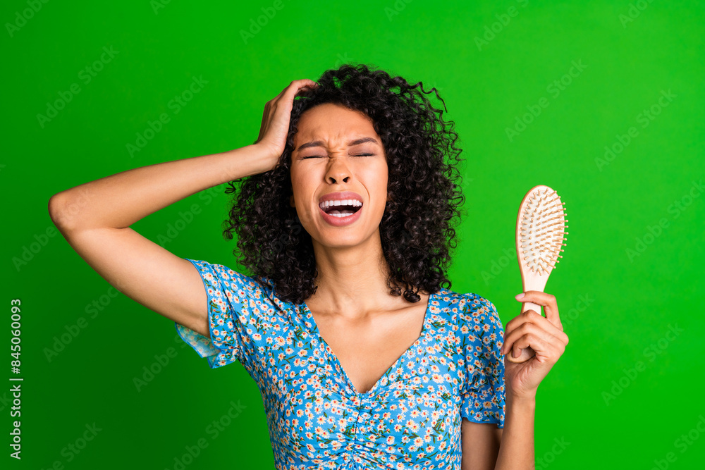 Photo of nice young woman hold brush cry wear top isolated on green color background Photo of nice young woman hold brush cry wear top isolated on green color background
