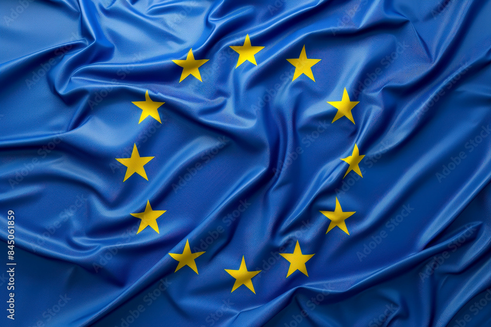 a silk flag of the European Union blowing in the wind. a silk flag of the European Union blowing in the wind.