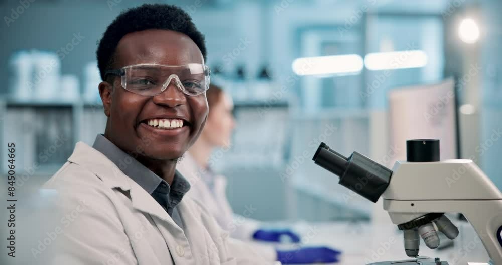 Black man, scientist and forensic with microscope for research, new discovery or examination at laboratory. Face of young African, male person or biologist with smile for science or test at lab Black man, scientist and forensic with microscope for research, new discovery or examination at laboratory. Face of young African, male person or biologist with smile for science or test at lab
