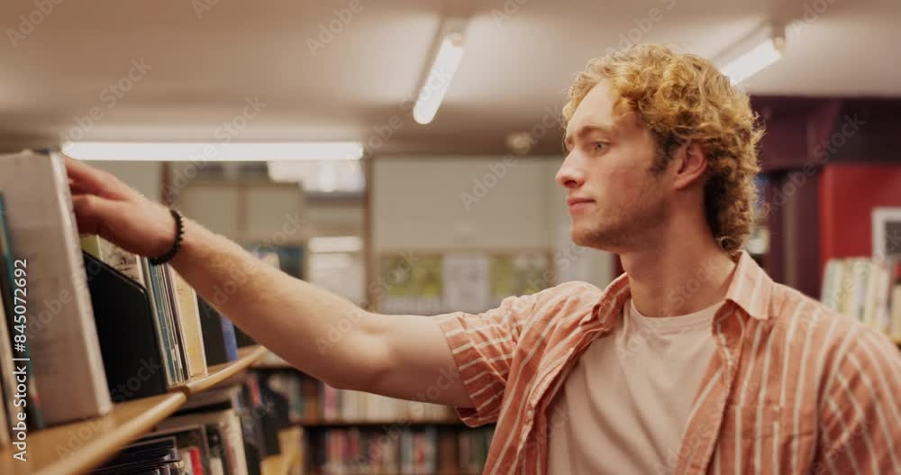Search, student and man in library looking for textbook with education, knowledge or learning. University, information and male learner at bookshelf for studying, project research or scholarship Search, student and man in library looking for textbook with education, knowledge or learning. University, information and male learner at bookshelf for studying, project research or scholarship