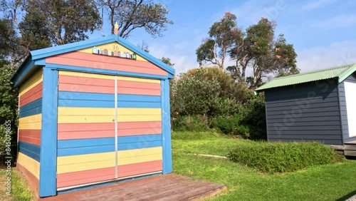 Colorful Beach Boxes by the Ocean photo