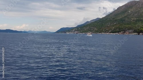 A scene captured from a boat floating on the serene sea waters of the Elafiti Islands, Croatia, embodying the concept of peaceful maritime exploration and natural beauty. photo