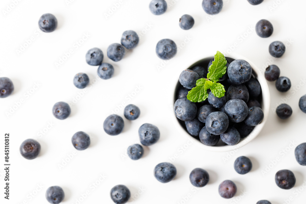 Ripe organic blueberries on white wooden table background. Selective focus. Ripe organic blueberries on white wooden table background. Selective focus.