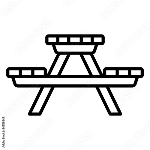 Icon of a wooden picnic table with long chairs
