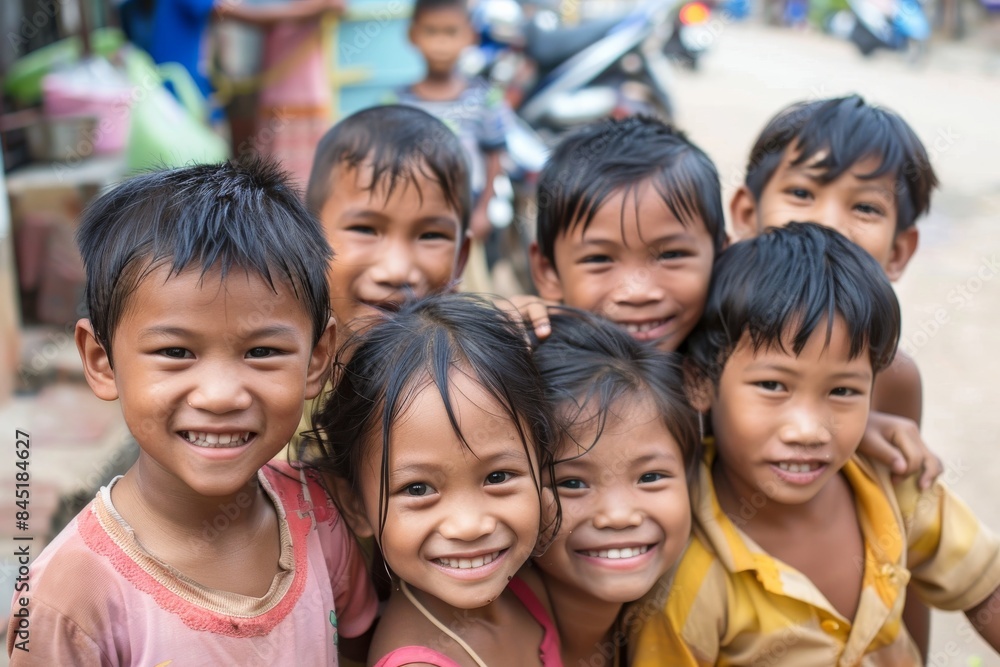Group of asian children smiling at the camera in the street. Group of asian children smiling at the camera in the street.